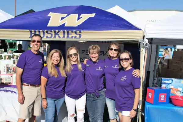 Port Susan Dental Care team in front of booth at National Night Out