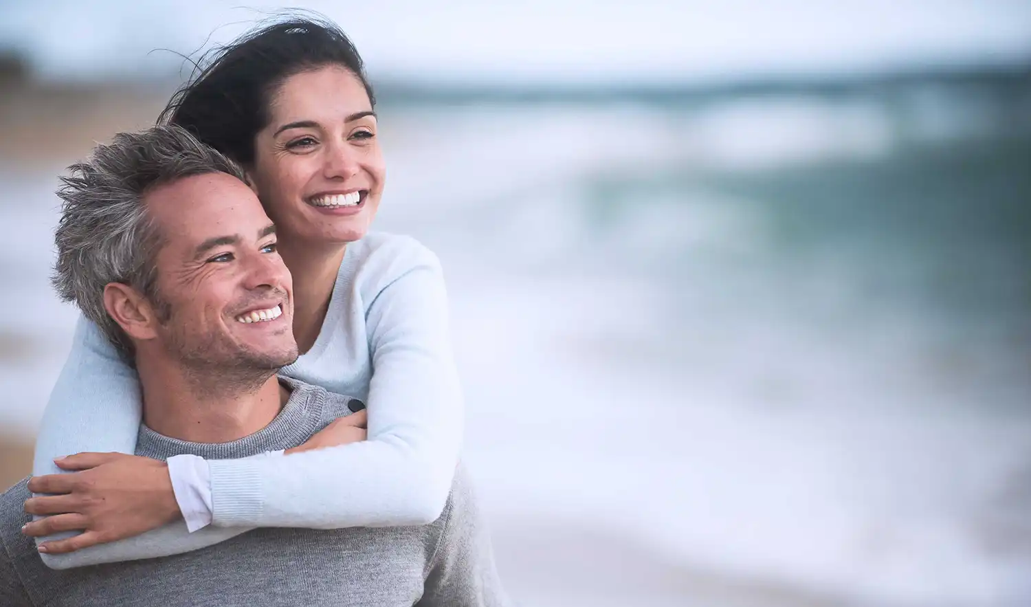 A man and woman smiling together