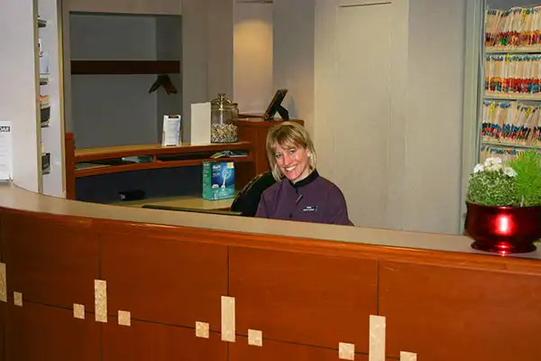 Sonia at the front desk of Port Susan Dental Care in Stanwood, WA